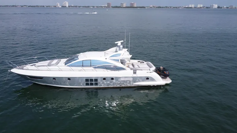 Slide: The Image of 2007 Azimut 62S yacht cruising on open water. - 4
