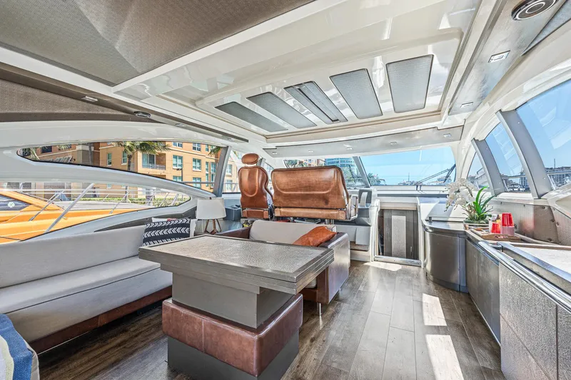 Slide: The Image of Luxurious interior of a 2007 Azimut 62S yacht with modern seating and panoramic windows. - 45