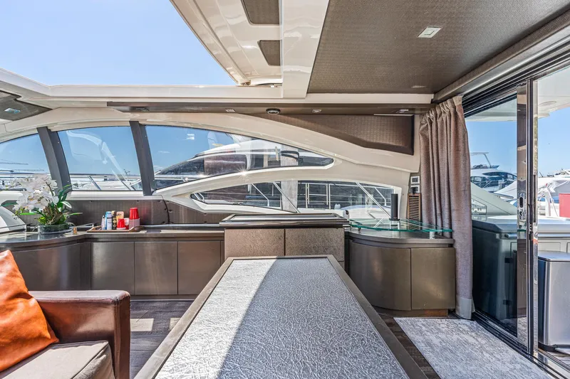 Slide: The Image of Luxurious interior of 2007 Azimut 62S yacht with modern design and panoramic windows. - 49