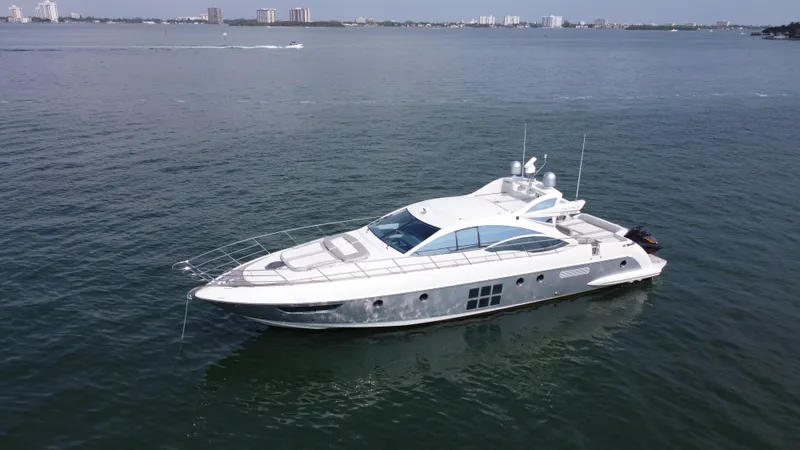 Slide: The Image of 2007 Azimut 62S yacht cruising on open water, showcasing sleek design and luxury. - 6