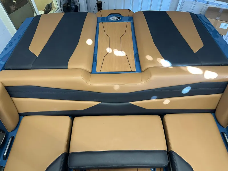 Slide: The Image of 2025 Axis A245 boat interior with tan and black seating design. - 5