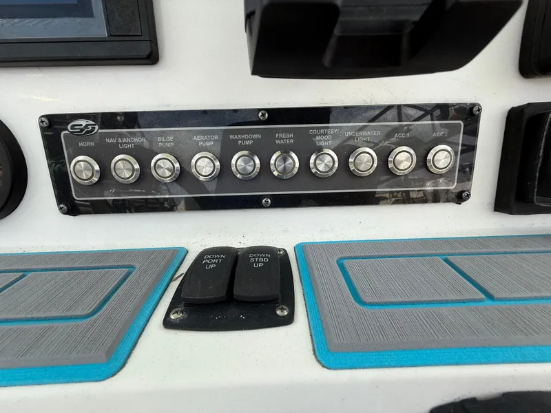 Slide: The Image of Control panel of a 2019 Sea Fox 228 Commander boat with labeled switches. - 12