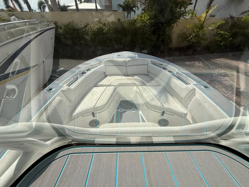 Slide: The Image of 2019 Sea Fox 228 Commander boat interior with cushioned seating and deck view. - 16