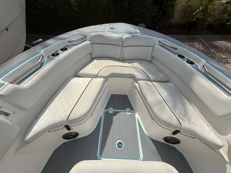 Slide: The Image of 2019 Sea Fox 228 Commander boat interior with cushioned seating and cup holders. - 17