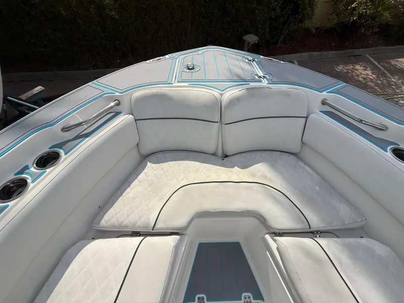 Slide: The Image of 2019 Sea Fox 228 Commander boat interior with white cushioned seating and cup holders. - 18