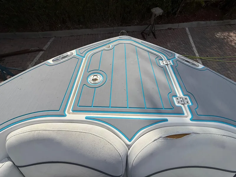 Slide: The Image of 2019 Sea Fox 228 Commander boat deck with blue accents and cushioned seating. - 19