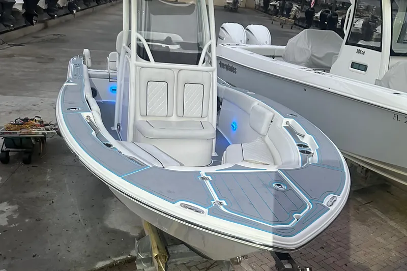 Slide: The Image of 2019 Sea Fox 228 Commander boat with sleek design and modern features, docked at marina. - 20