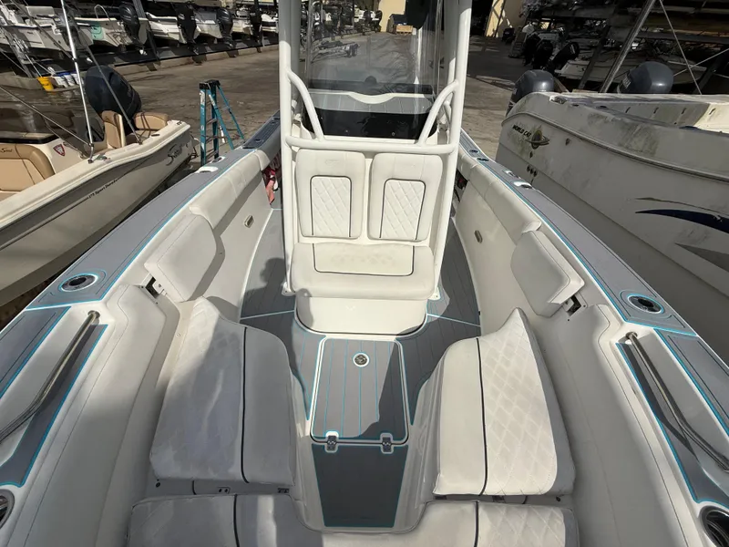 Slide: The Image of 2019 Sea Fox 228 Commander boat interior with cushioned seating and center console. - 23