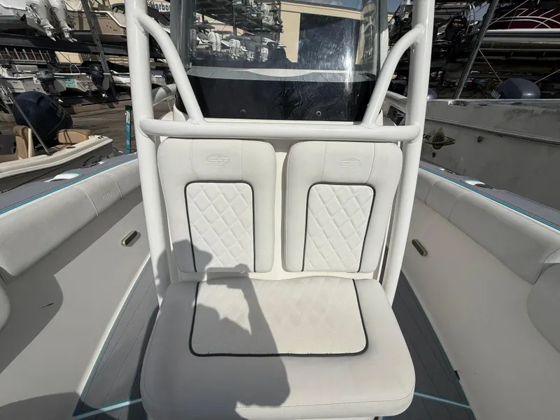 Slide: The Image of 2019 Sea Fox 228 Commander boat seating with white cushioned upholstery. - 24