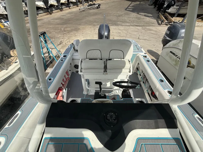 Slide: The Image of 2019 Sea Fox 228 Commander boat interior with seating and steering wheel. - 25