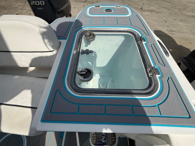 Slide: The Image of 2019 Sea Fox 228 Commander boat deck with seating and storage compartment. - 28
