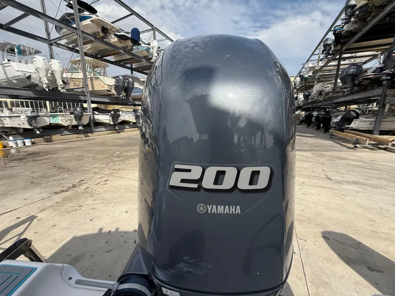 Slide: The Image of Yamaha 200 outboard motor on a 2019 Sea Fox 228 Commander boat in storage facility. - 29