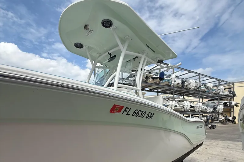 Slide: The Image of 2019 Sea Fox 228 Commander boat docked, showcasing sleek design and sturdy build. - 5