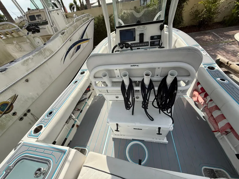 Slide: The Image of 2019 Sea Fox 228 Commander boat interior with fishing rod holders and navigation equipment. - 7