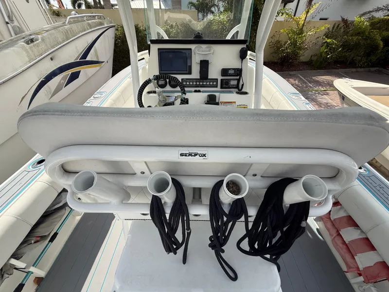 Slide: The Image of 2019 Sea Fox 228 Commander boat cockpit with fishing rod holders and control panel. - 8