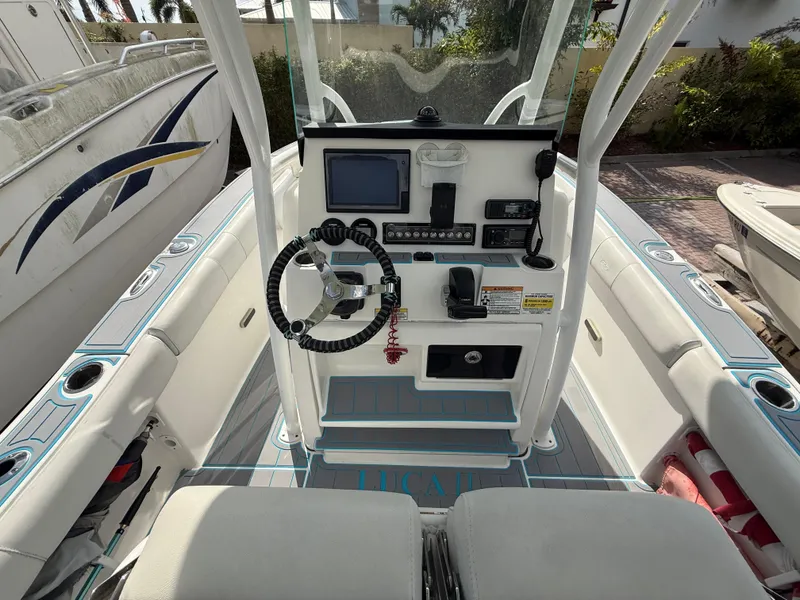 Slide: The Image of 2019 Sea Fox 228 Commander boat cockpit with steering wheel and control panel. - 9