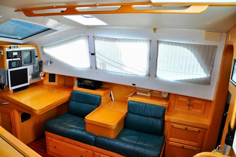 Slide: The Image of Interior of 2000 Roger Hill Cruising Cutter with navigation equipment and seating area. - 19