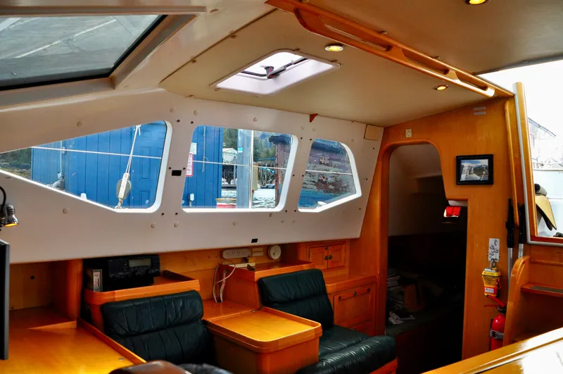 Slide: The Image of Interior of 2000 Roger Hill Cruising Cutter with wood finish and seating area. - 21