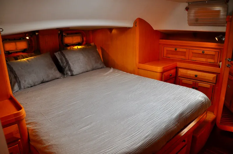 Slide: The Image of Luxurious cabin interior of 2000 Roger Hill Cruising Cutter with cozy bed and wooden furnishings. - 28
