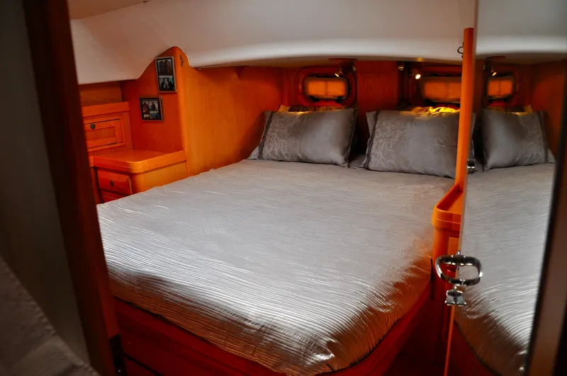 Slide: The Image of Luxurious cabin interior of 2000 Roger Hill Cruising Cutter yacht with cozy bedding. - 30