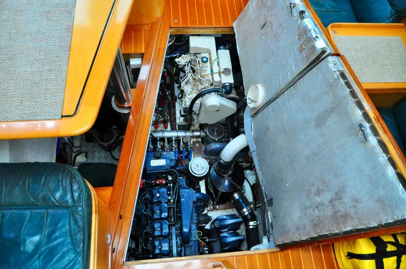 Slide: The Image of Engine compartment of a 2000 Roger Hill Cruising Cutter, showcasing detailed mechanical components. - 39