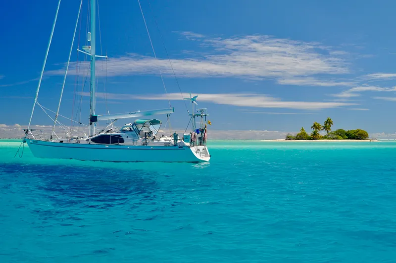 Slide: The Image of Sailing yacht Roger Hill Cruising Cutter 2000 near tropical island, clear blue water. - 44
