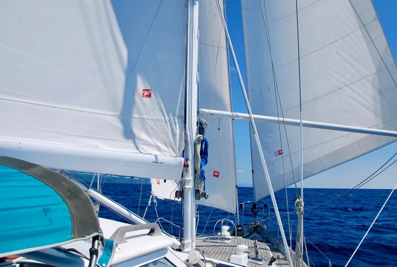 Slide: The Image of Roger Hill 2000 Cruising Cutter sailing on open sea with full sails. - 7