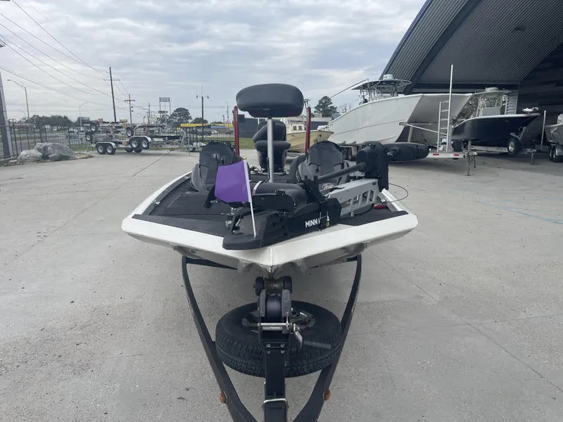 Slide: The Image of 2015 Ranger RT188 boat with Minn Kota trolling motor in a marina setting. - 8