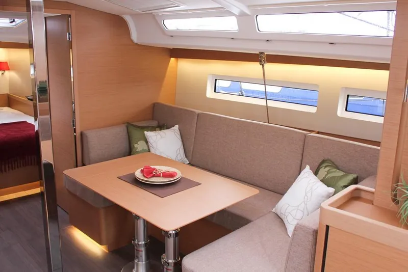 Slide: The Image of Interior of 2025 Jeanneau Sun Odyssey 440 yacht with cozy seating and dining area. - 39