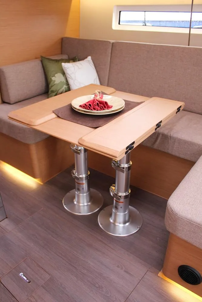 Slide: The Image of Interior of 2025 Jeanneau Sun Odyssey 440 yacht with modern dining area and adjustable table. - 47