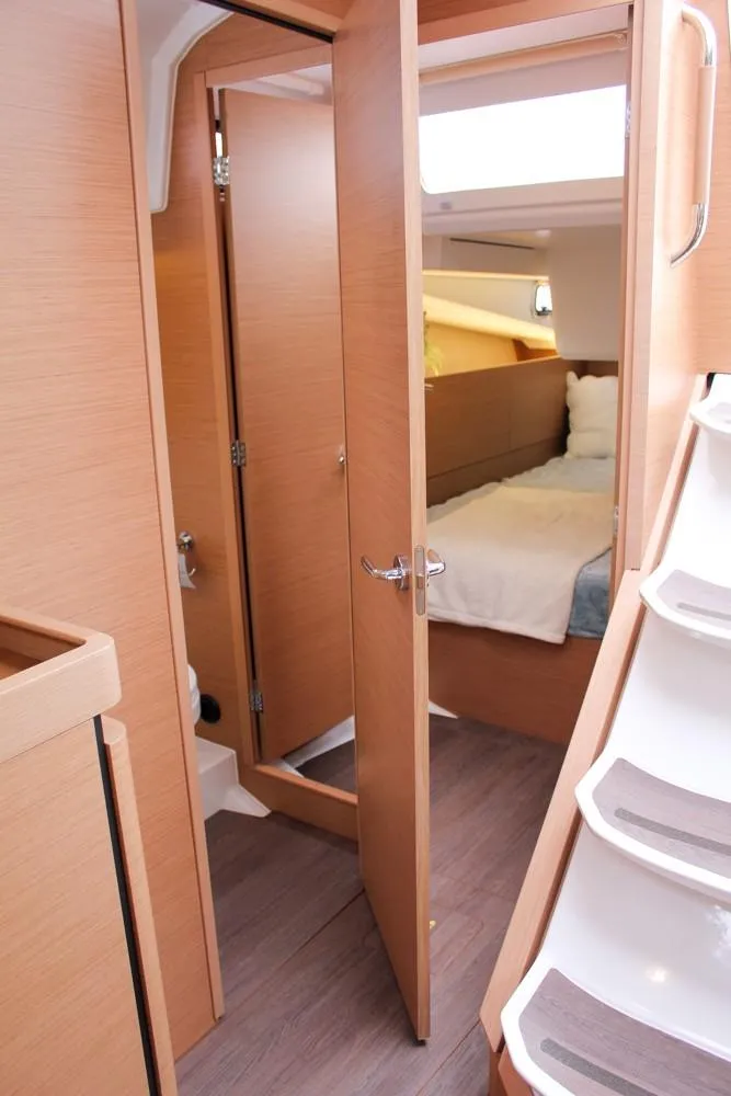 Slide: The Image of Interior of 2025 Jeanneau Sun Odyssey 440 yacht, featuring a cozy cabin and modern design. - 34