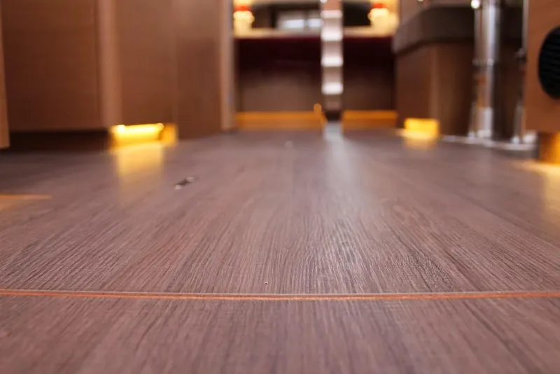 Slide: The Image of Interior flooring of 2025 Jeanneau Sun Odyssey 440 yacht, featuring elegant wood finish. - 43