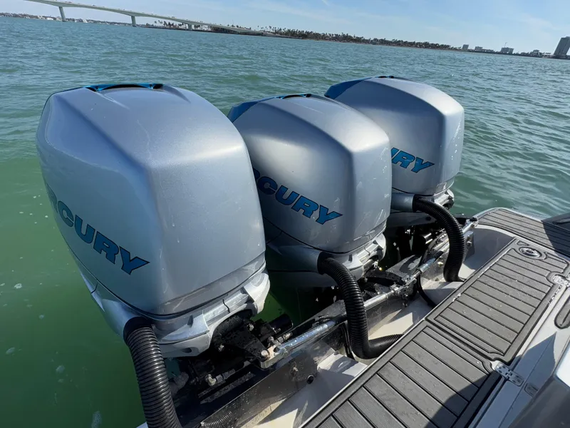 Slide: The Image of Triple Mercury outboard engines on 2020 Nor-Tech 340 Sport Open Center Console boat. - 10