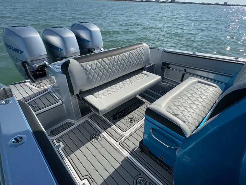 Slide: The Image of 2020 Nor-Tech 340 Sport Open Center Console with luxurious seating and triple Mercury engines. - 21
