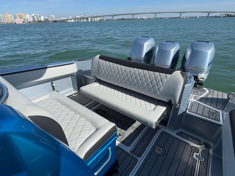 Slide: The Image of 2020 Nor-Tech 340 Sport Open Center Console boat with luxurious seating and triple engines. - 22
