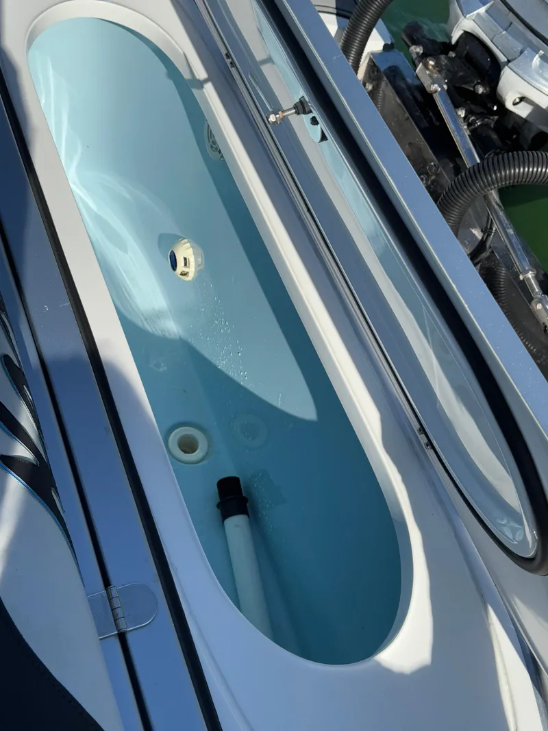 Slide: The Image of 2020 Nor-Tech 340 Sport Open Center Console livewell, showcasing sleek design and functionality. - 23