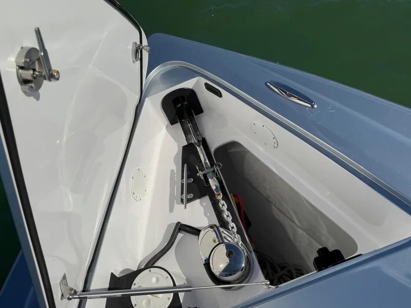 Slide: The Image of Open anchor compartment of 2020 Nor-Tech 340 Sport Open Center Console boat. - 30