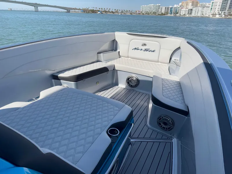 Slide: The Image of Luxurious interior of 2020 Nor-Tech 340 Sport Open Center Console boat on water. - 4
