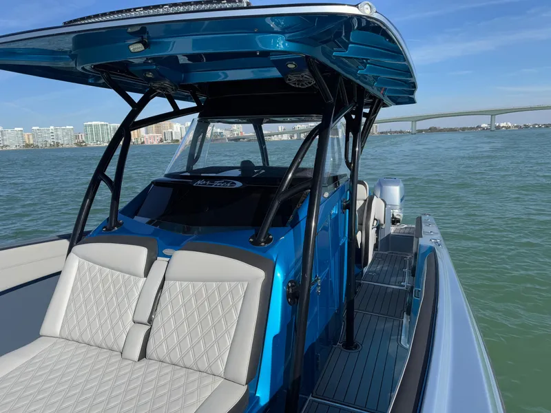 Slide: The Image of 2020 Nor-Tech 340 Sport Open Center Console boat on water, featuring sleek design and modern amenities. - 6