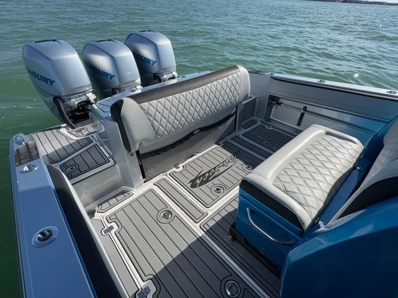 Slide: The Image of 2020 Nor-Tech 340 Sport Open Center Console with triple Mercury engines on water. - 9