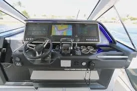 Slide: The Image of 2021 Azimut Verve 47 yacht helm with advanced navigation displays and controls. - 10