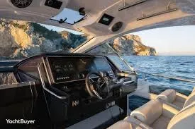 Slide: The Image of Interior view of 2021 Azimut Verve 47 yacht with ocean and cliffs in background. - 13