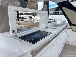 Slide: The Image of Outdoor kitchen on 2021 Azimut Verve 47 yacht with modern stovetop and sleek design. - 16
