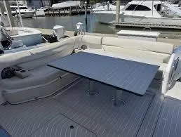 Slide: The Image of 2021 Azimut Verve 47 yacht interior with seating and table, docked at marina. - 22