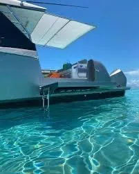 Slide: The Image of Azimut Verve 47 yacht, 2021 model, floating on clear turquoise water under a sunny sky. - 9