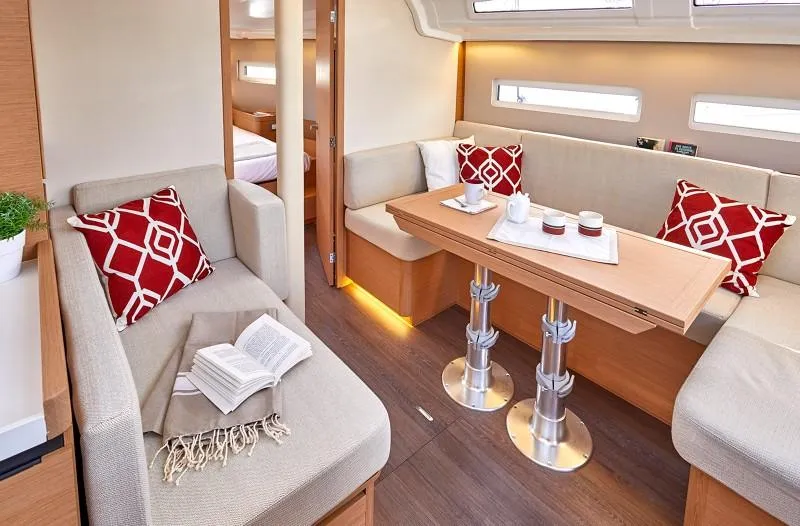 Slide: The Image of 2025 Jeanneau Sun Odyssey 410 interior with cozy seating and modern decor. - 11