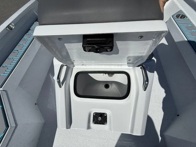 Slide: The Image of Open storage compartment in 2025 Xpress Hyper-Lift Series H20B boat console. - 11
