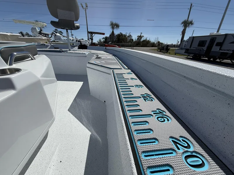 Slide: The Image of 2025 Xpress Hyper-Lift Series H20B boat interior with measuring ruler detail. - 5