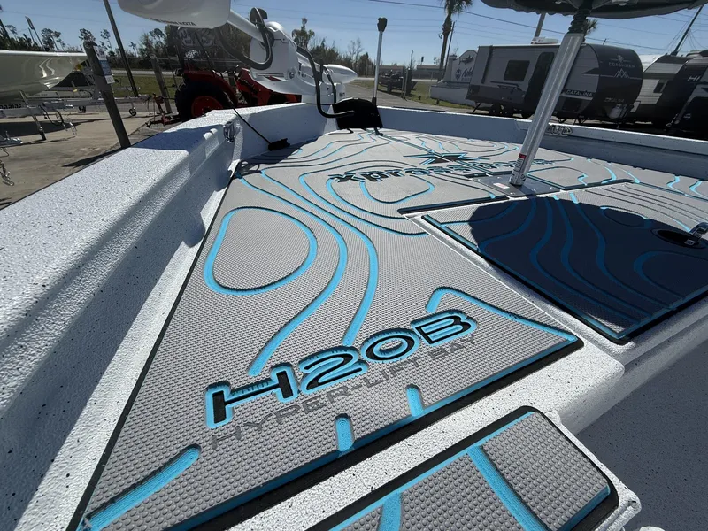 Slide: The Image of 2025 Xpress Hyper-Lift Series H20B boat deck with modern console design. - 6