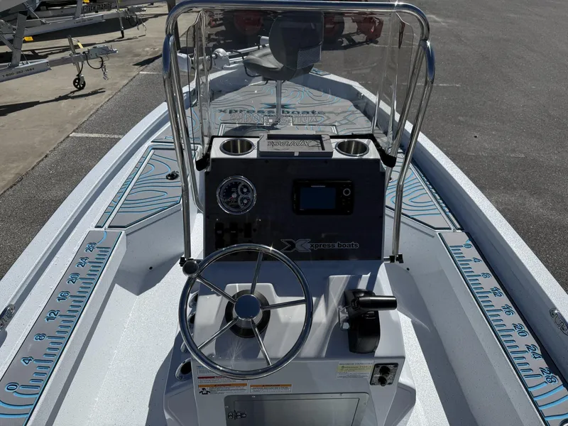 Slide: The Image of 2025 Xpress Hyper-Lift Series H20B boat console with steering wheel and gauges. - 8